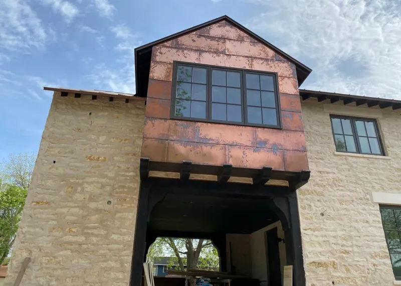 Copper metal panel facade on a stone building for Metal Roof Coating in Pinson
